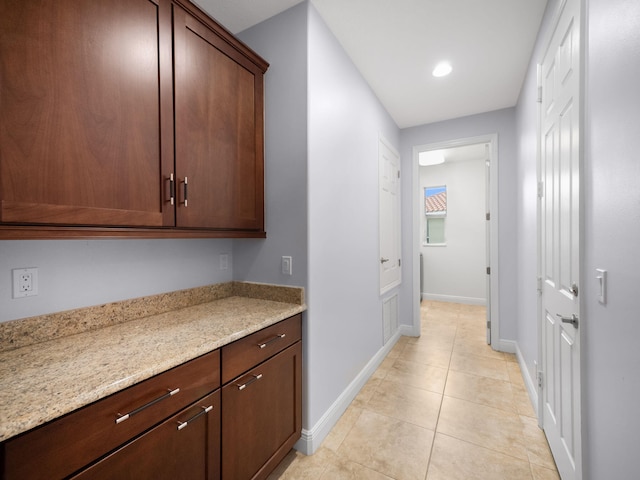 hallway featuring light tile patterned flooring