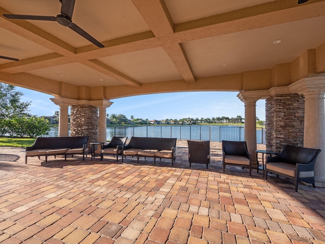 view of patio featuring an outdoor living space with a fireplace and ceiling fan