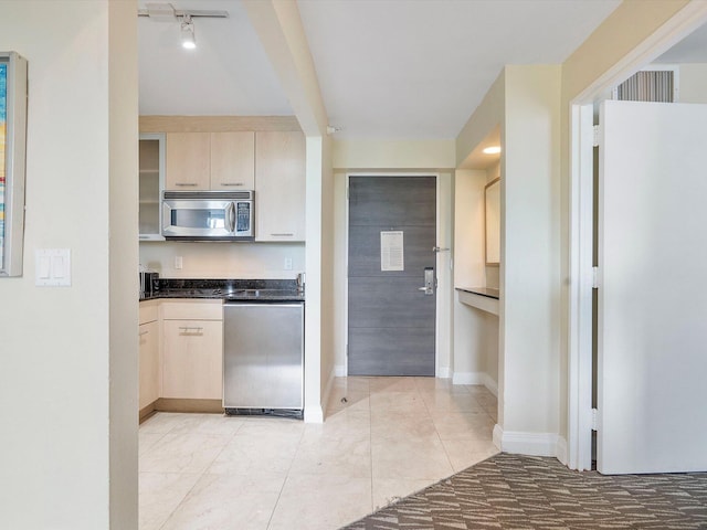 kitchen featuring light brown cabinets