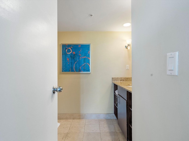 bathroom featuring tile patterned flooring and vanity