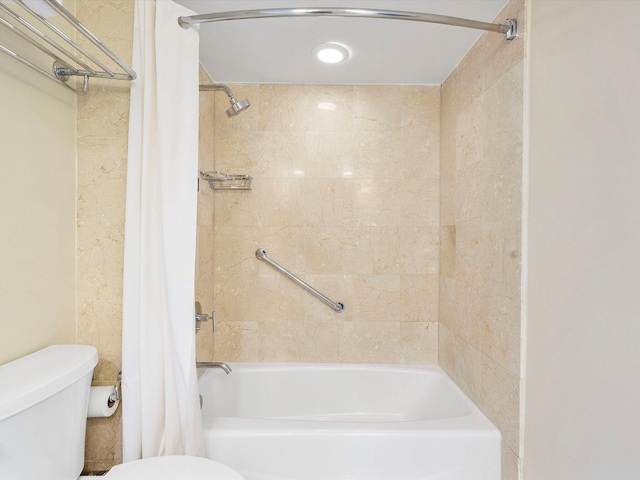 bathroom with shower / bath combo with shower curtain and toilet