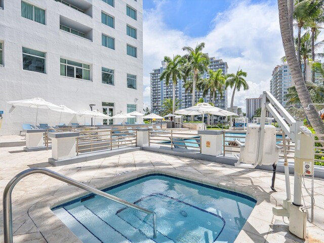 view of swimming pool with a patio area