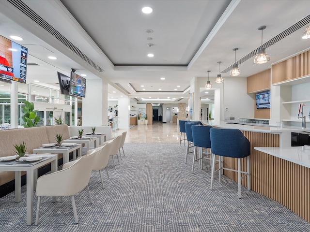 dining space featuring a tray ceiling