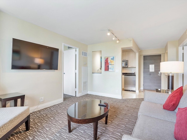 living room featuring light carpet