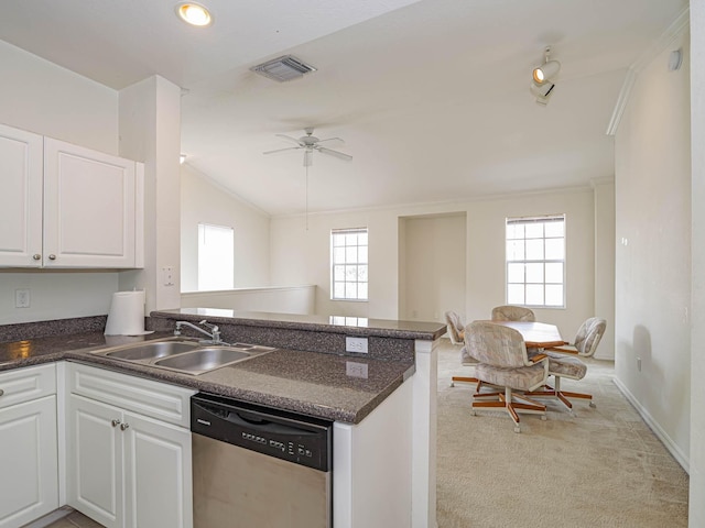 kitchen featuring dishwasher, light carpet, sink, ceiling fan, and white cabinetry