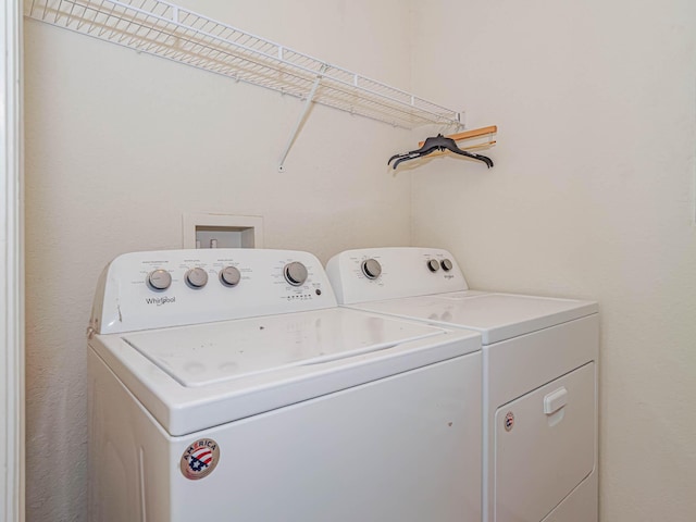 washroom featuring washer and clothes dryer