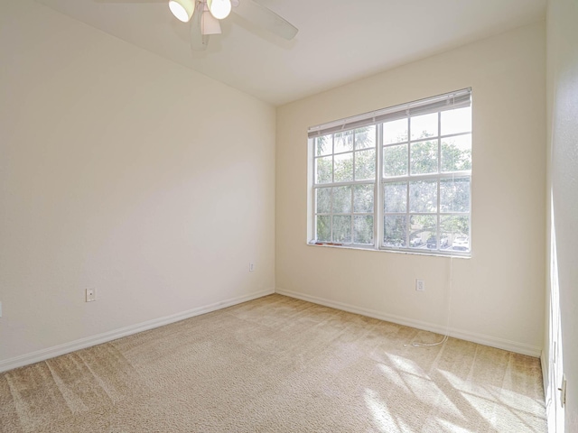 carpeted empty room with ceiling fan