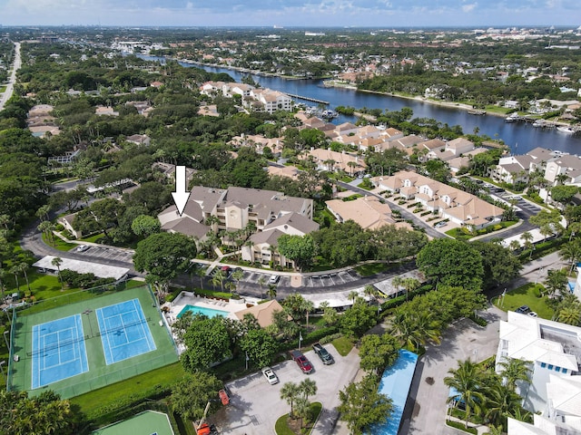 birds eye view of property with a water view