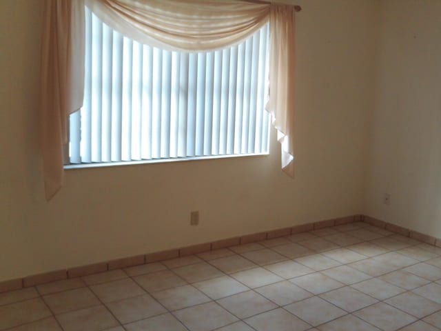 view of tiled spare room