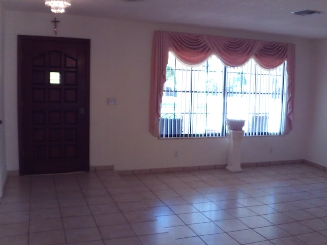 tiled entryway with plenty of natural light