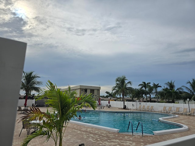 view of swimming pool featuring a patio