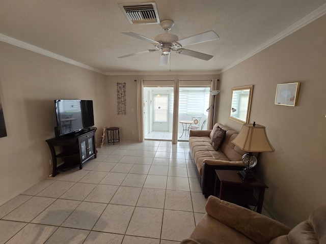 tiled living room featuring ceiling fan and ornamental molding