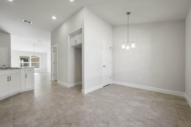 interior space with a notable chandelier