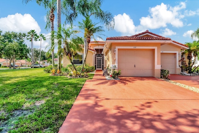 mediterranean / spanish-style house featuring a garage and a front lawn