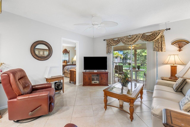 living room with ceiling fan and light tile patterned floors