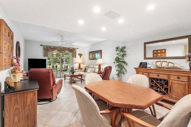 dining space with light tile patterned flooring and ceiling fan