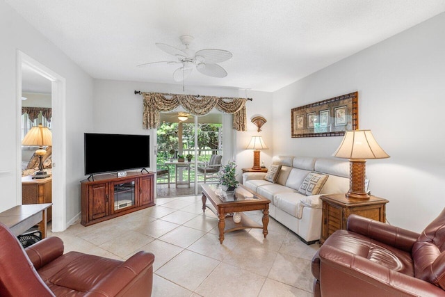 living room featuring ceiling fan and light tile patterned floors