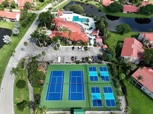 birds eye view of property with a water view