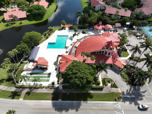 birds eye view of property with a water view