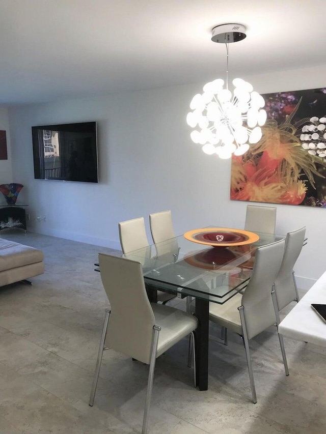 dining space featuring a chandelier