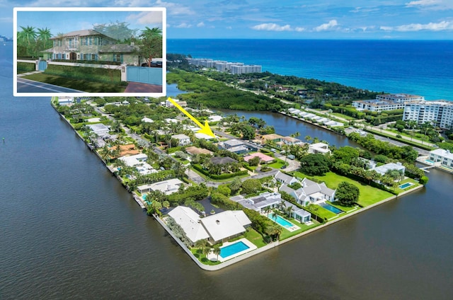 birds eye view of property featuring a water view