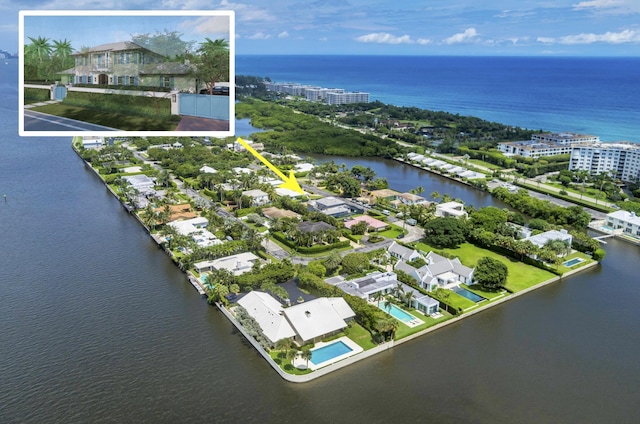 birds eye view of property featuring a water view