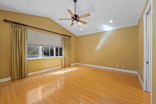 spare room with ceiling fan, lofted ceiling, and light hardwood / wood-style floors