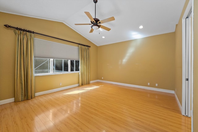 10860 Fairmont Village Dr, Lake Worth, FL 33449 - empty room featuring light wood finished floors, baseboards, a ceiling fan, and lofted ceiling
