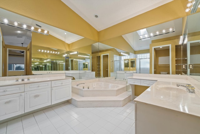 10860 Fairmont Village Dr, Lake Worth, FL 33449 - bathroom featuring two vanities, a bath, tile patterned flooring, vaulted ceiling, and a sink