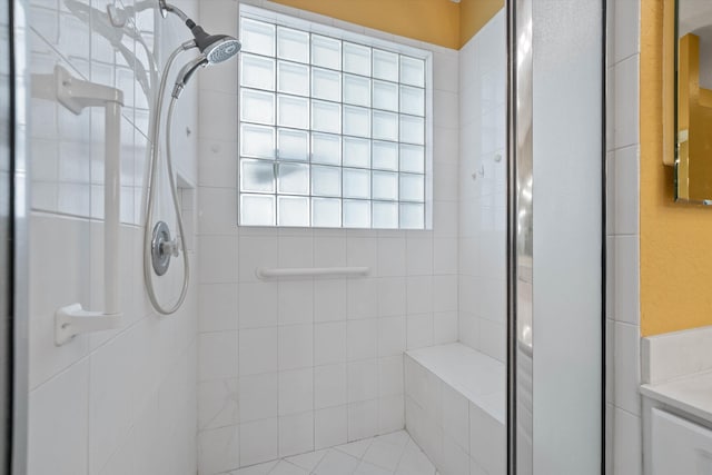 bathroom featuring vanity and tiled shower