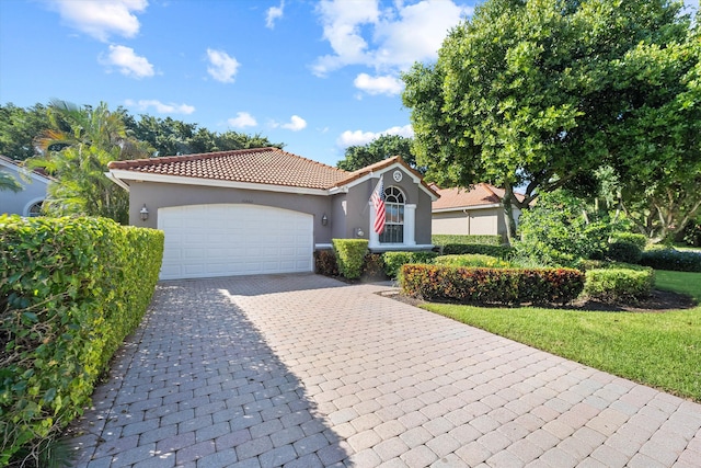 10860 Fairmont Village Dr, Lake Worth, FL 33449 - mediterranean / spanish house featuring a tiled roof, stucco siding, decorative driveway, a front lawn, and a garage