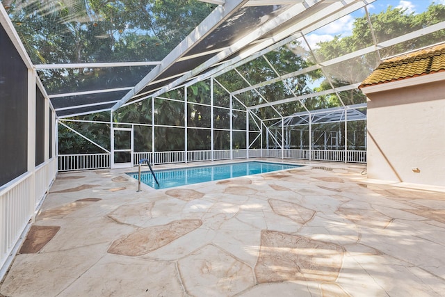 view of pool with a lanai and a patio area