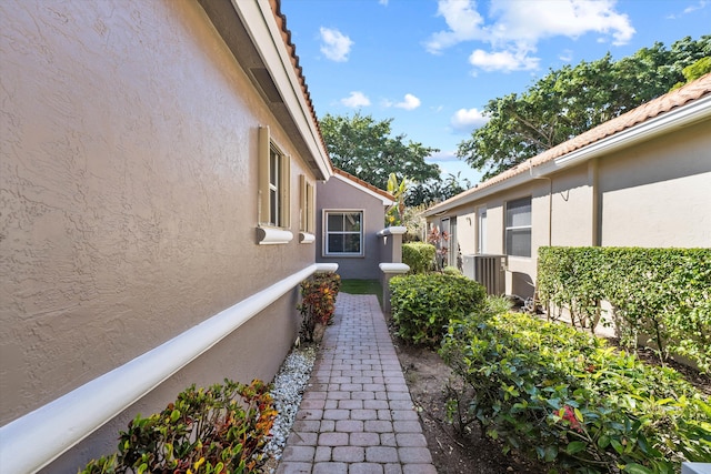 10860 Fairmont Village Dr, Lake Worth, FL 33449 - view of property exterior featuring stucco siding and a tile roof
