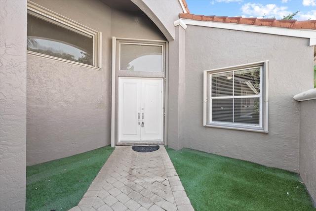 10860 Fairmont Village Dr, Lake Worth, FL 33449 - entrance to property featuring a tiled roof and stucco siding