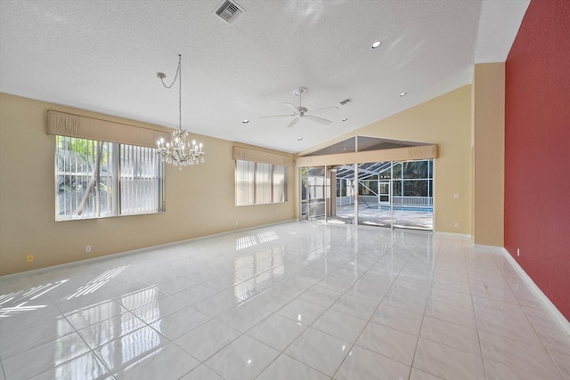 10860 Fairmont Village Dr, Lake Worth, FL 33449 - tiled empty room with visible vents, ceiling fan with notable chandelier, a textured ceiling, and lofted ceiling