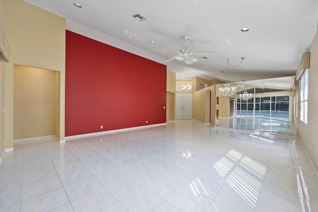 unfurnished living room featuring ceiling fan with notable chandelier