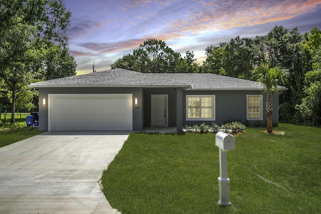 3534 NW 32nd Ave, Okeechobee, FL 34972 - single story home featuring stucco siding, driveway, a garage, and a shingled roof