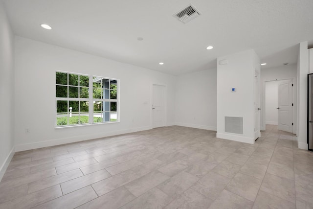 3534 NW 32nd Ave, Okeechobee, FL 34972 - spare room featuring recessed lighting and baseboards