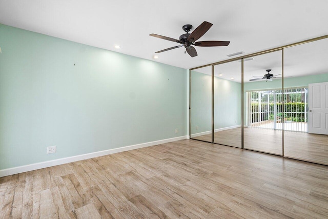 unfurnished bedroom with a closet, ceiling fan, and light hardwood / wood-style floors