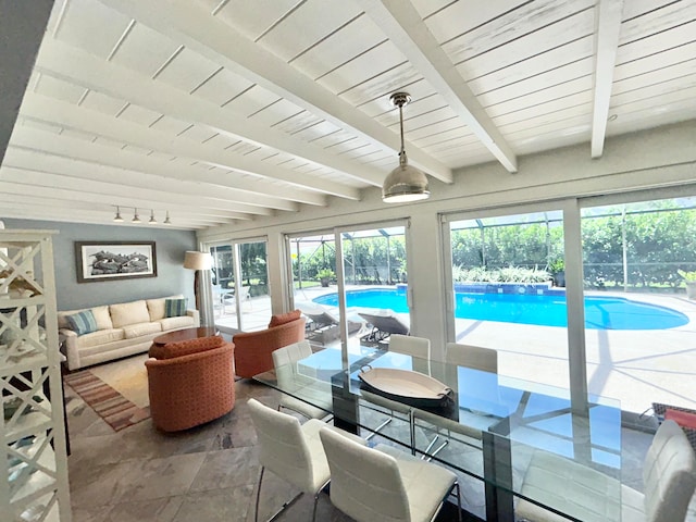 sunroom featuring wood ceiling, a pool, and beam ceiling