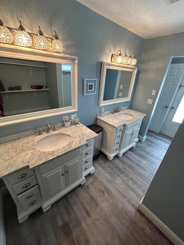 bathroom with vanity and hardwood / wood-style flooring