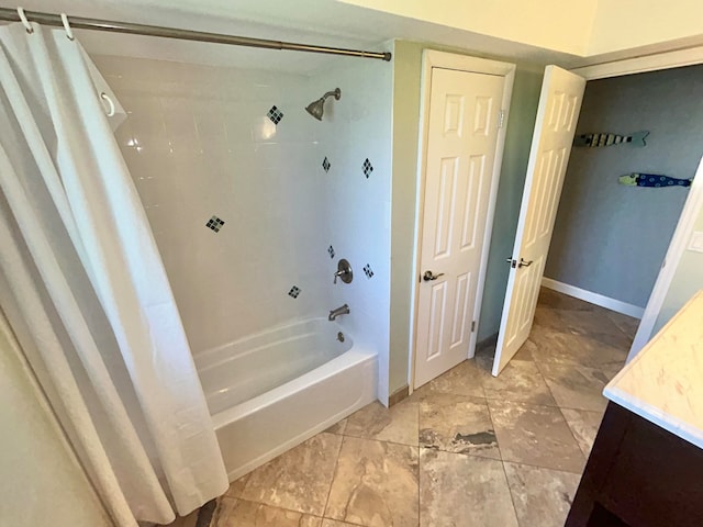 bathroom featuring vanity and shower / bath combo