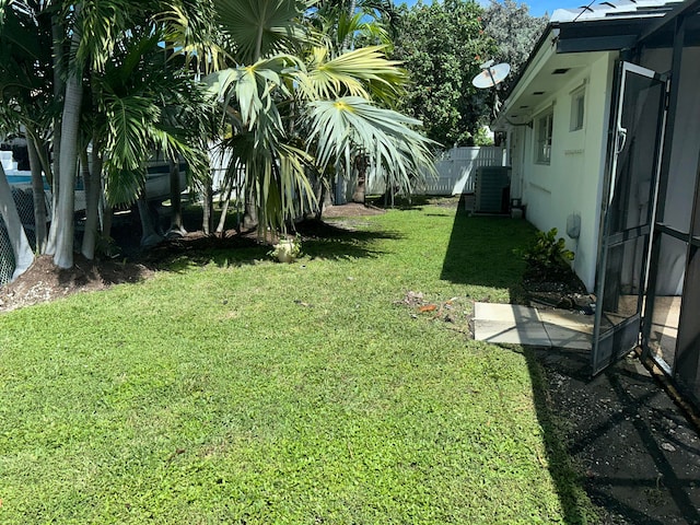 view of yard featuring central AC