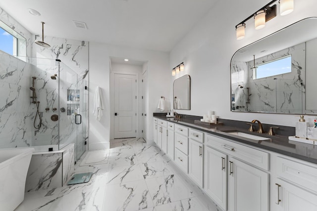full bathroom with visible vents, a sink, marble finish floor, a marble finish shower, and a soaking tub
