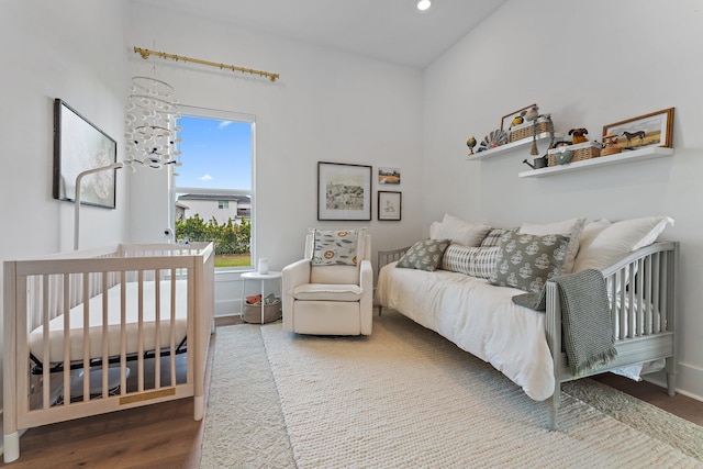 bedroom with hardwood / wood-style floors