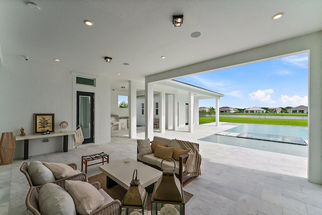 view of patio featuring area for grilling, outdoor lounge area, and an outdoor pool
