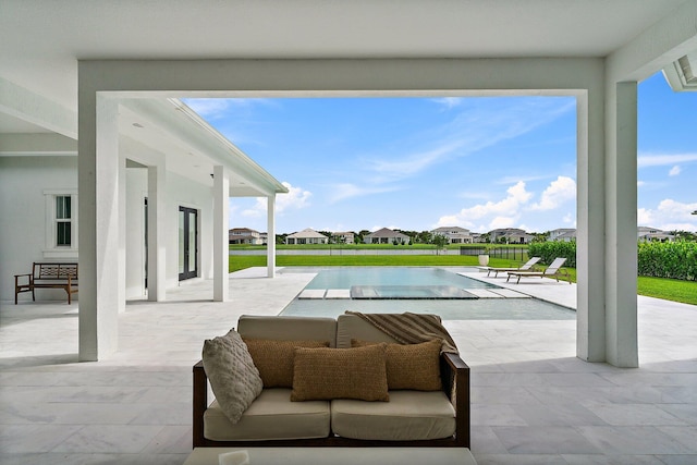 view of patio / terrace with a fenced in pool and a residential view