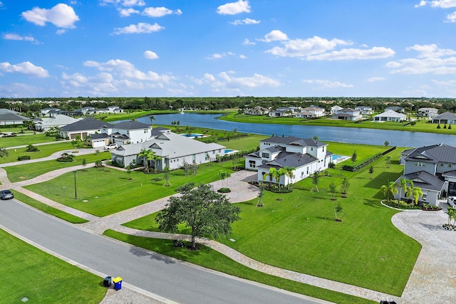 birds eye view of property featuring a water view and a residential view
