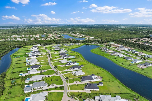 aerial view with a residential view and a water view