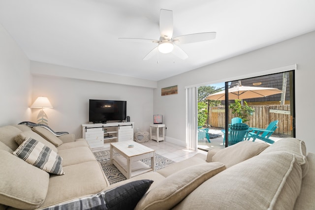 tiled living room with ceiling fan